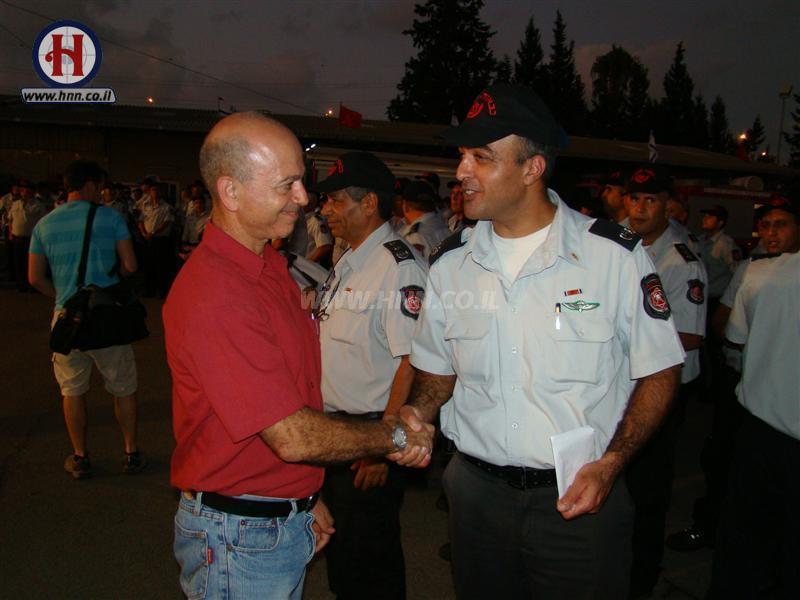Congratulating firemen after ribbon award