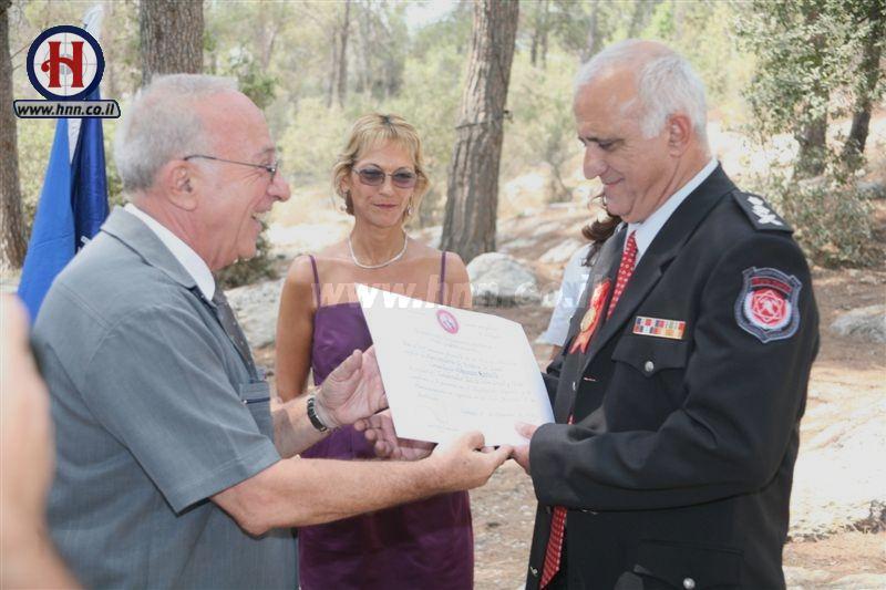 Shimon Romach receives document