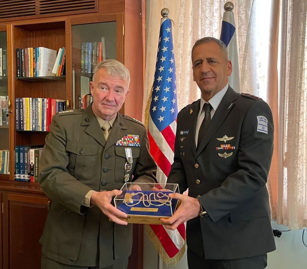 Gen. Frank McKenzie with medal of Appreciation