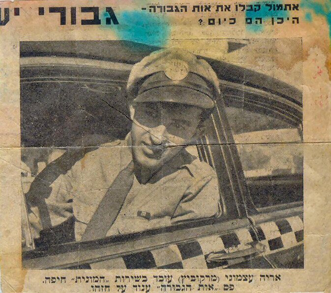 Arieh Atzmoni, driving a cab. 