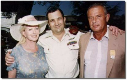 Pinhas Noy with his wife and Ehud Barak